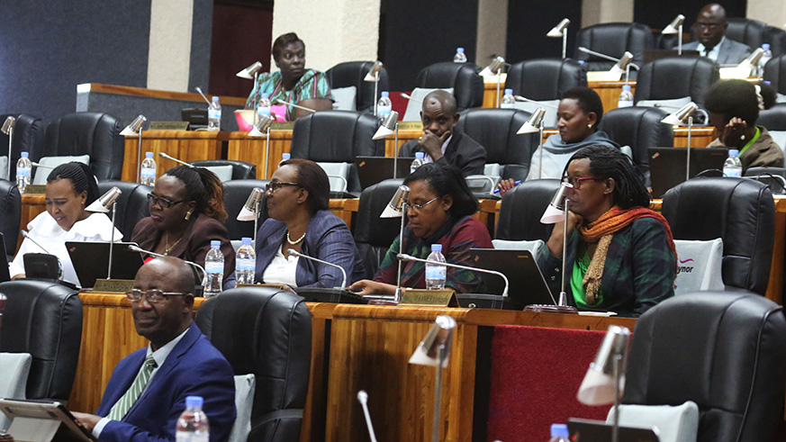 Members of parliament follow Auditor General Obadia Biraro as he addresses them yesterday (Sam Ngendahimana)