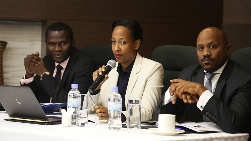 Crystal Ventures chief executive Iza Irame (centre) speaks as Cherno Gaye, CFA Director (left), and Jean Bosco Sebabi, Deputy Director General in charge of Funds Management at the Rwanda Social Security Board, look on during the meeting yesterday. Sam Ngendahimana.