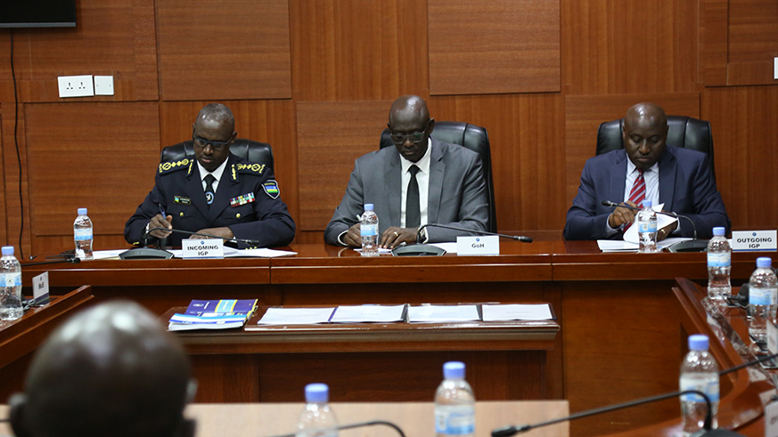 Busingye (centre) commended the outgoing Police Chief, for his dedication, sacrifice, loyalty and personality during his nine years at the helm of the Police Force.