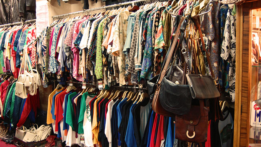 Second-hand wear stalls in a market. Net photo.