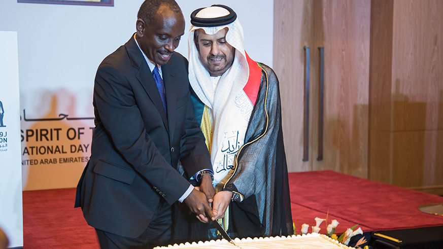 The Minister of Foreign Affairs, Richard Sezibera and Hazza Mohammed Falah Kharsan Alqahtani, the Ambassador of the United Arab Emirates cut the cake in celebration of UAEu2019s 47th National Day. Nadege Imbabazi.