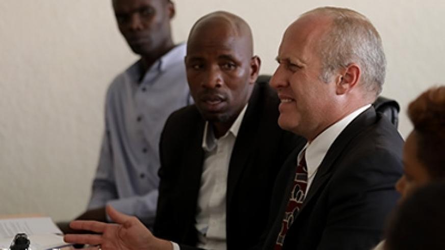 Amazing Grace Radio proprietor (right) Gregory Ryan Schoof appears before Rwanda Media Commission in February 2018. / File