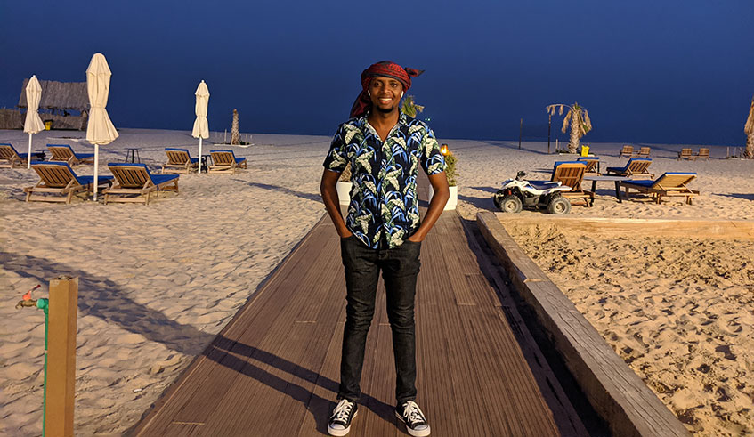 The author poses for a photo at Al Majles in south of Qatar after a desert trip.