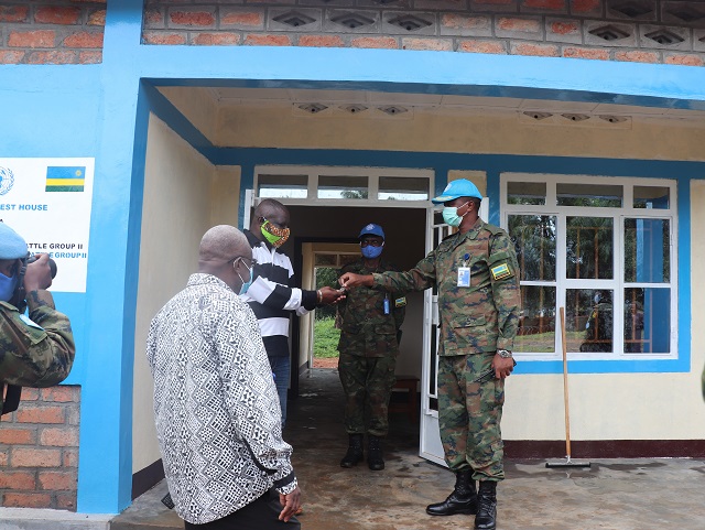 An RDF officer hands over the guest house to local authorities. 