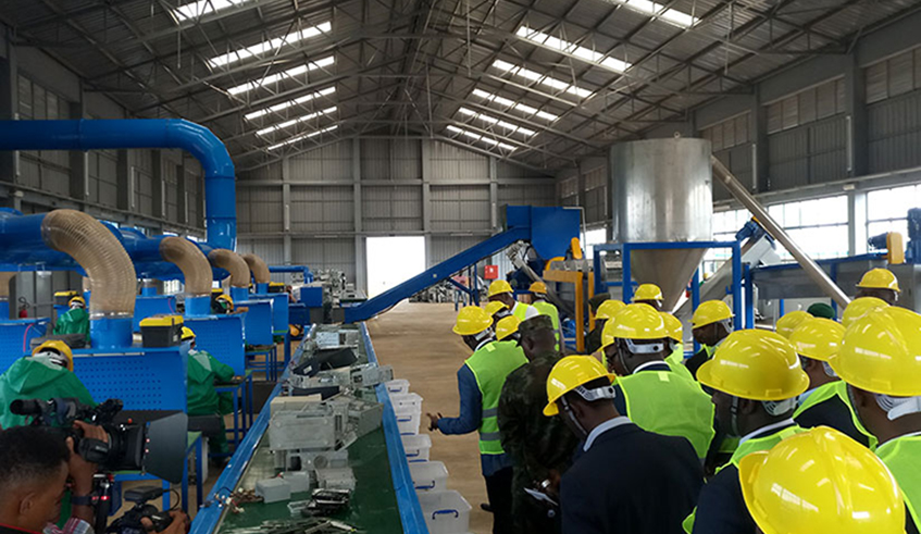 Officials tour an e-waste recycling and dismantling facility in Bugesera in 2019. / Photo: File.