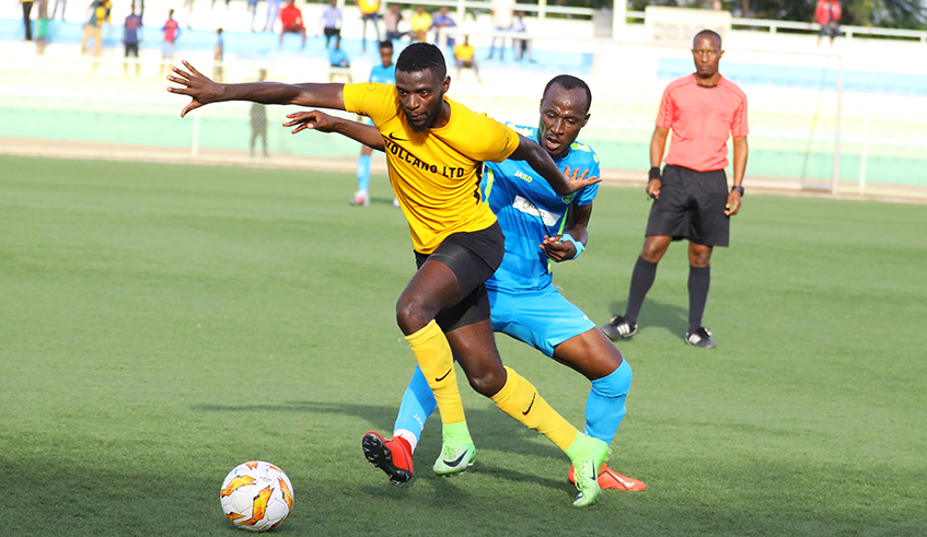 Gasogi FC striker Bertrand Iradukunda dribbles past AS Kigali midfielder Nsabimana during a league match last season. The mid-season transfer win- dow has been postponed as Ferwafa waits for a go ahead for the league resumption. / Sam Ngendahimana.