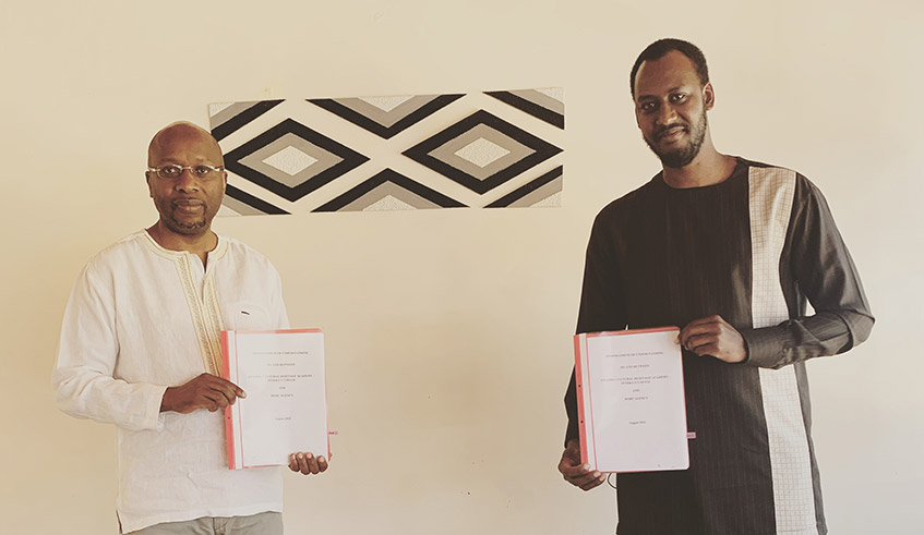 Rwanda Culture and Heritage Academy Directir General Amb. Robert Masozera (L) and Raoul Rugamba, the CEO of Africa in Colors after signing the Momerandum of Understanding on Wednesday, August 25. / Courtesy