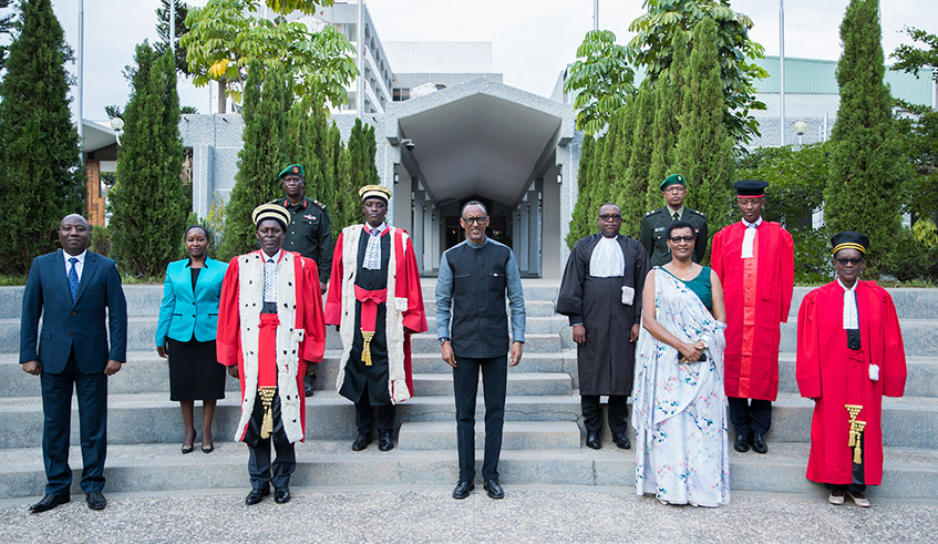 President Paul Kagame, flanked by Donatille Mukabalisa, the Speaker of the Chamber of Deputies (right) and Chief Justice Faustin Ntezilyayo, pose with some members of the legal fraternity at the Parliamentary Buildings in Kimihurura on Monday, September 6, shortly after the ceremony to launch the 2021/22 Judicial Year. / Photo: Village Urugwiro.