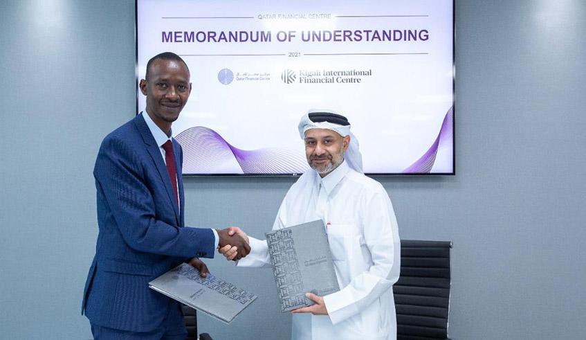 Nick Barigye, the Chief Executive of Rwanda Finance Limited (left), shakes hands with Yousuf Mohamed Al-Jaida, the Chief Executive of Qatar Financial Centre after signing the MoU in Doha, Qatar, on September 9. / Photo: Courtesy.