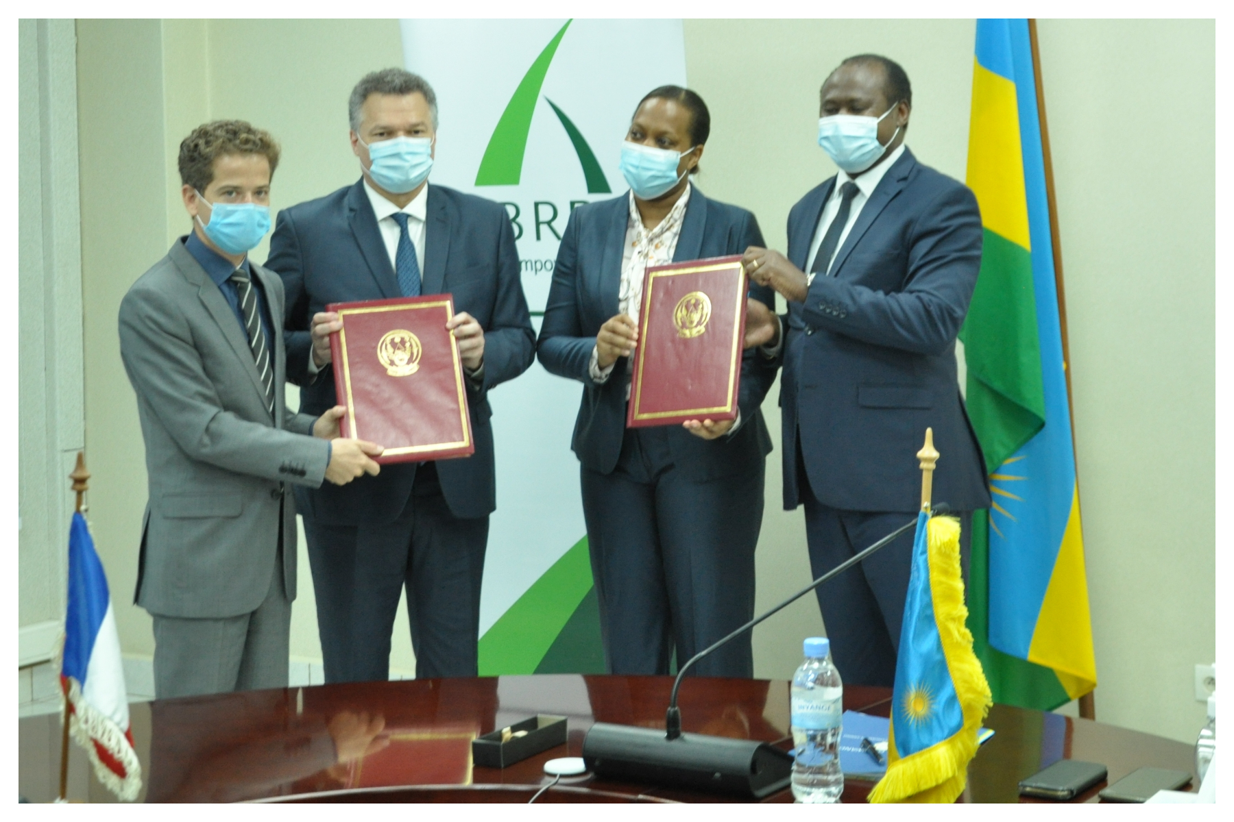 Officials pose for a picture after signing the agreement in Kigali on February18. / Courtesy 