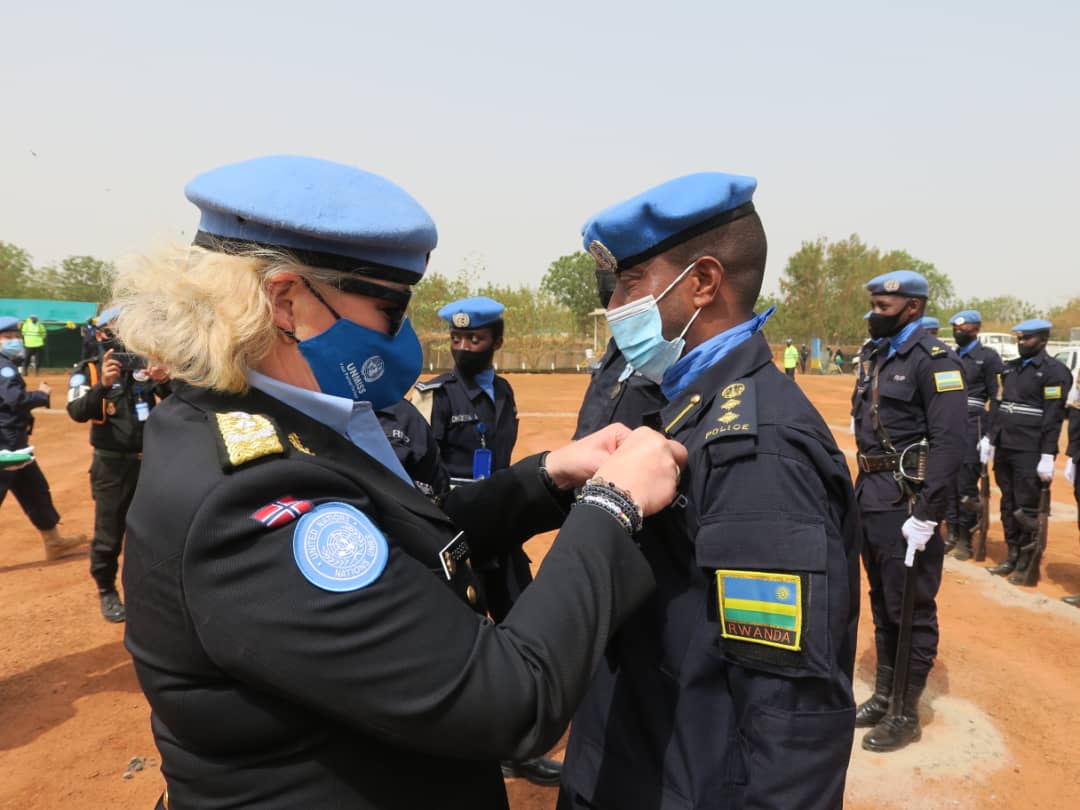 UNMISS Police Commissioner, Madam Christine Fossen decorates the Rwanda FPU-1 contingent commander, Chief Superintendent of Police (CSP) Faustin Kalimba during the medal pinning ceremony. 